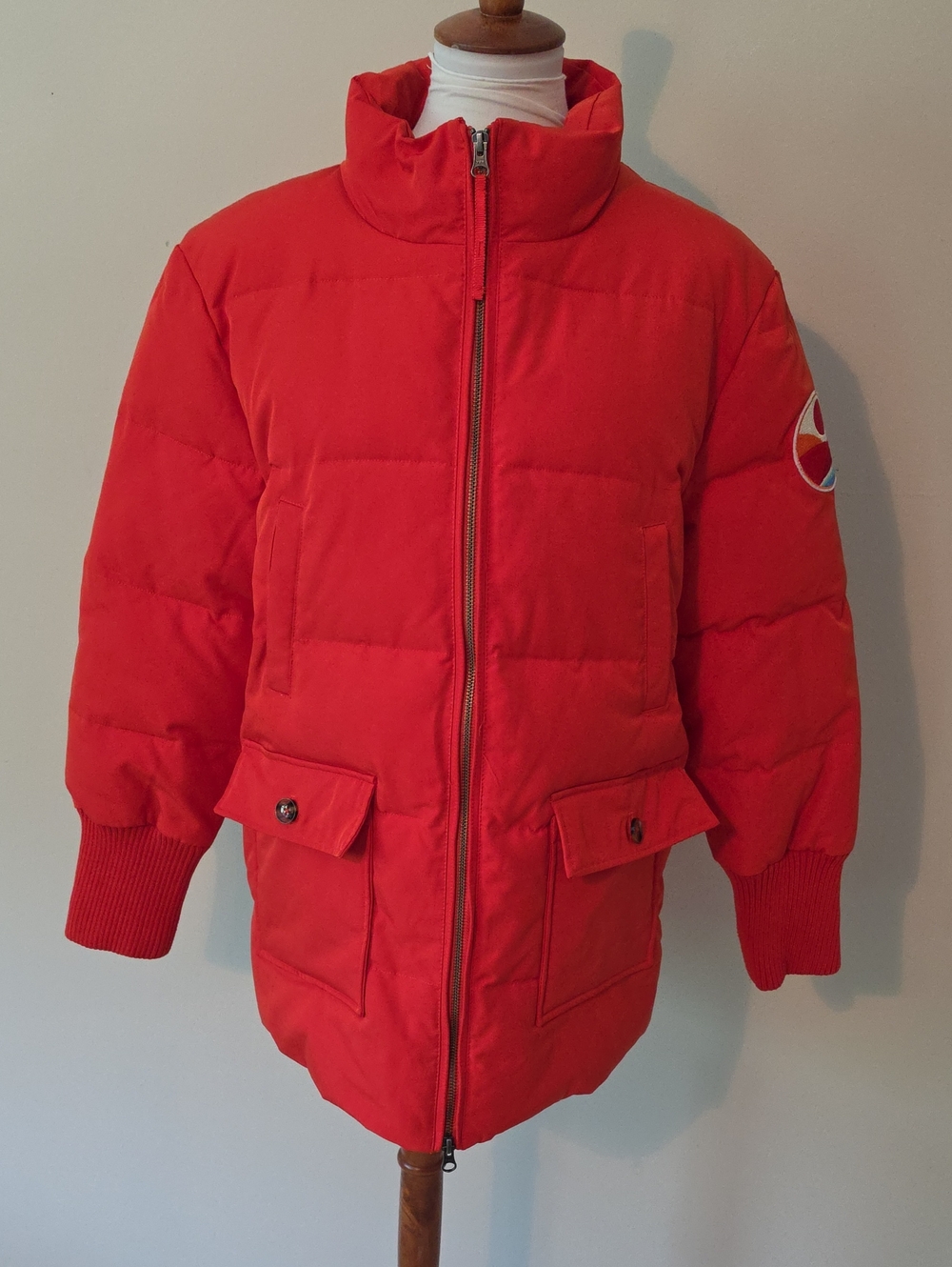 Sundance Puffer Jacket with Logo Patch “A shade between red and orange.”